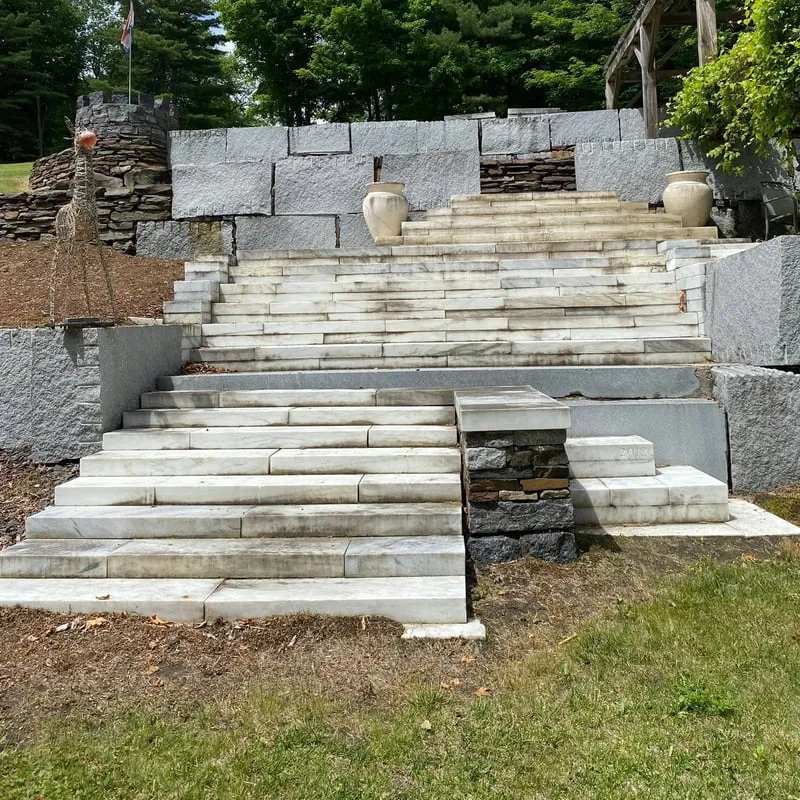 Freshly cleaned bluestone steps and granite retaining wall