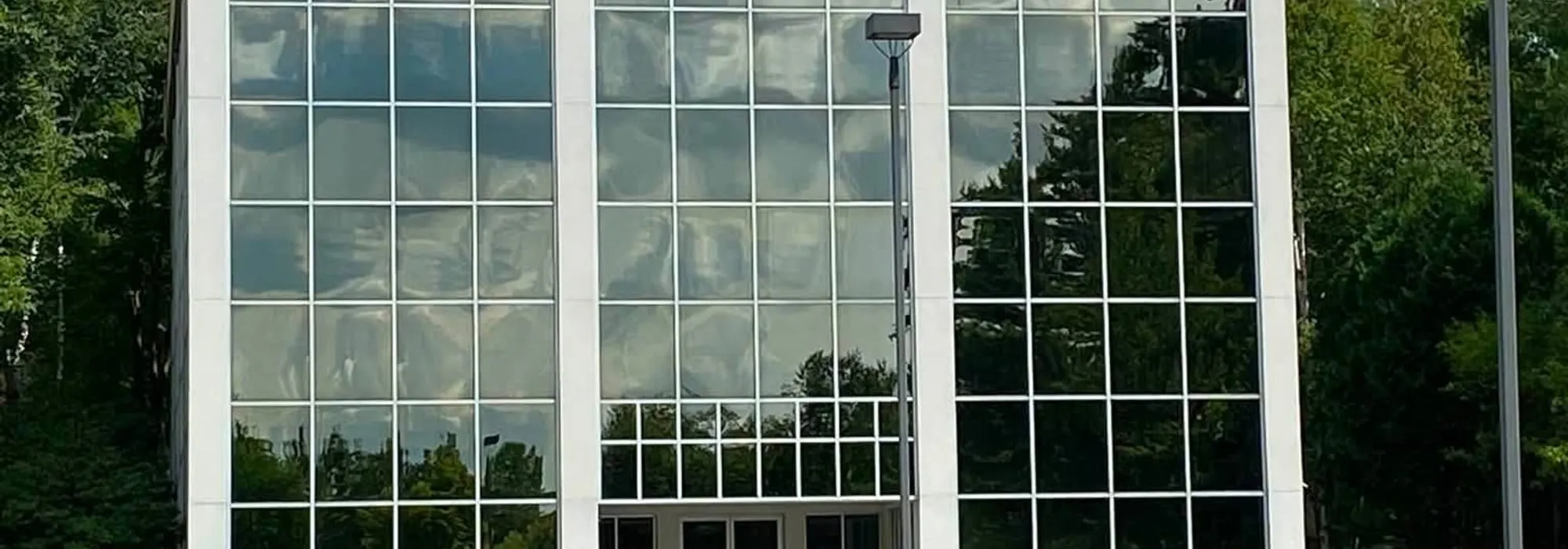 A commercial building exterior being cleaned
