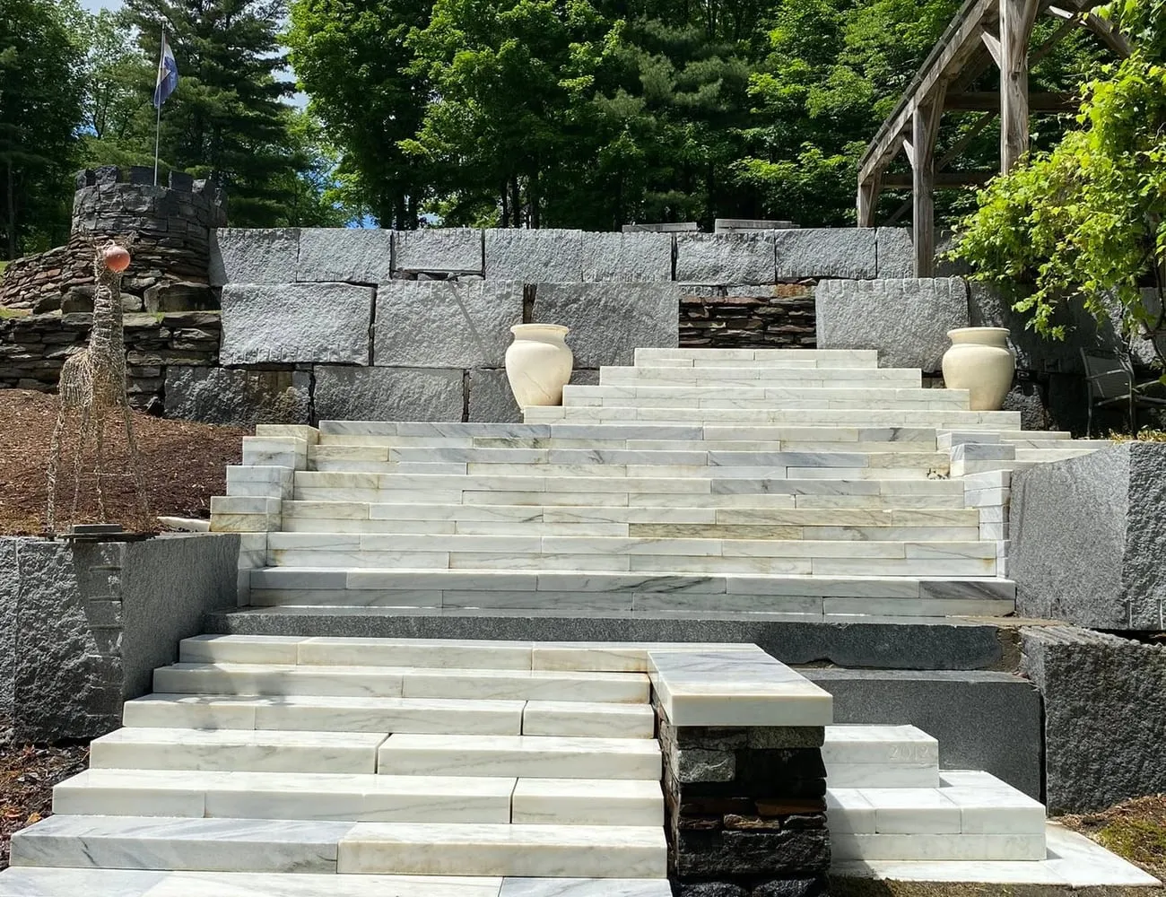 A concrete walkway part-way through cleaning, clean path beside dirty