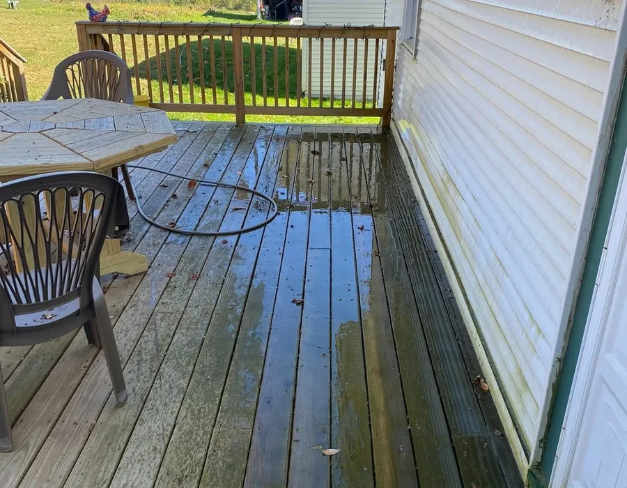 A wooden deck washed down to clean board