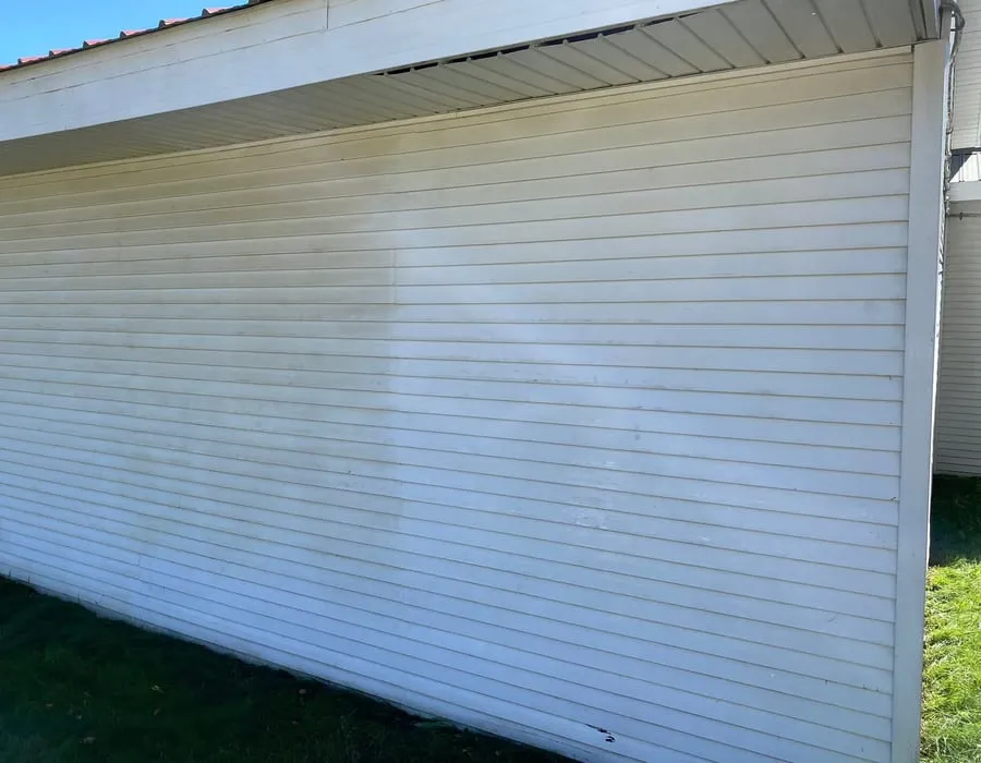 A long run of clean white siding on a Vermont home