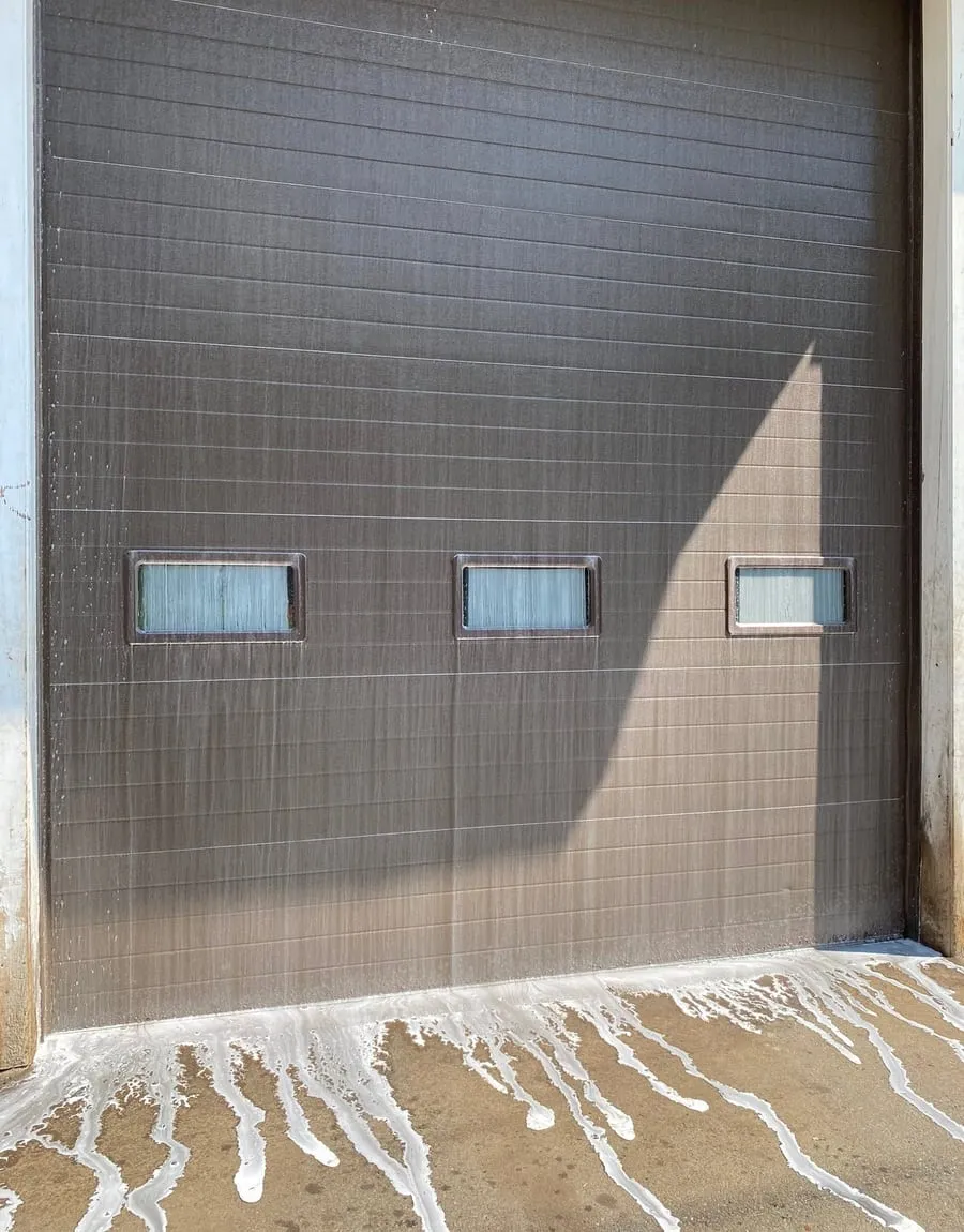 A garage door being washed down
