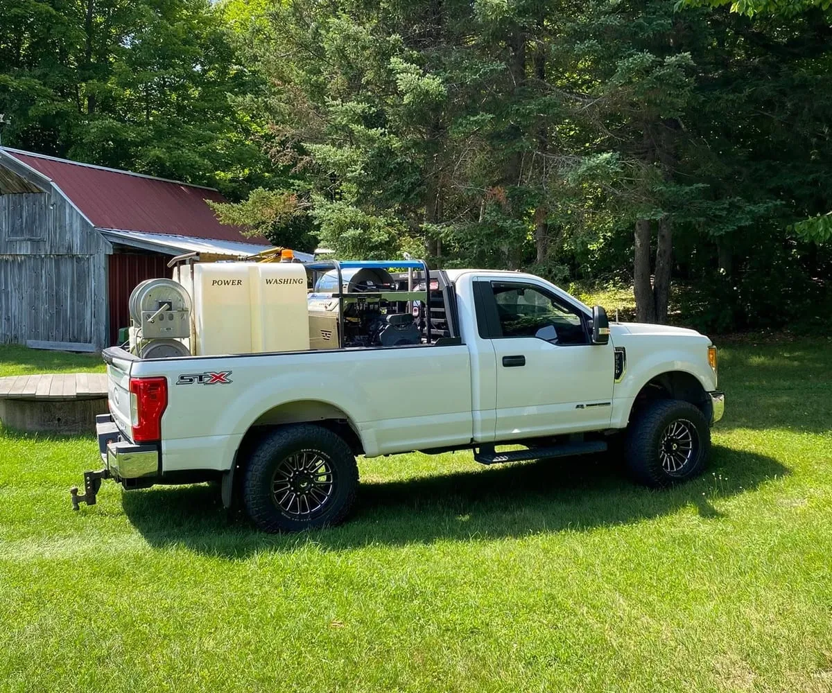 The Wash Works truck loaded with tanks and pressure washing equipment